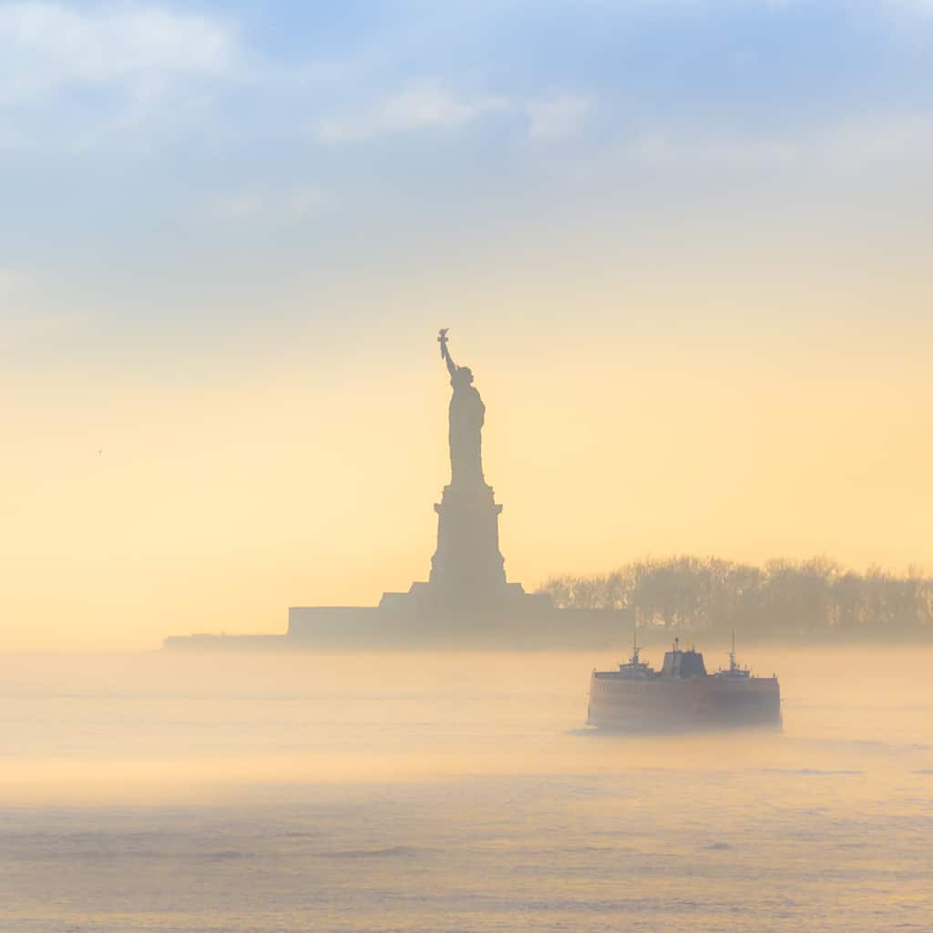 Staten Island Ferry cruises past the Statue of Liberty